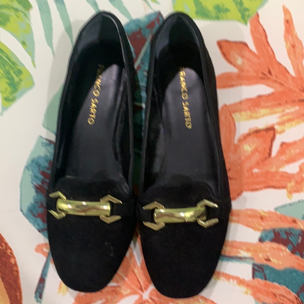 Black suede loafers with gold accents